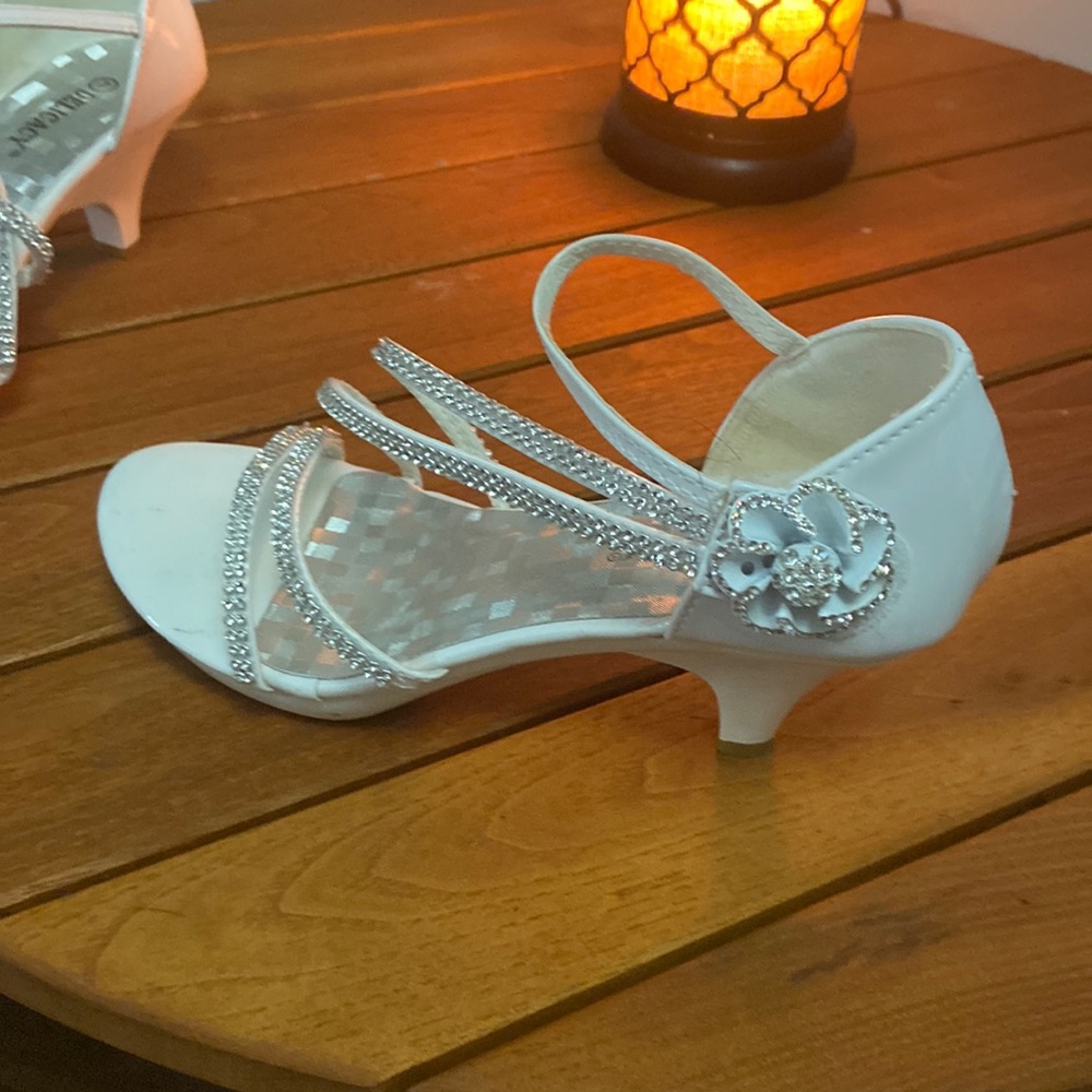 White strapped dress shoes with 1 inch heel.